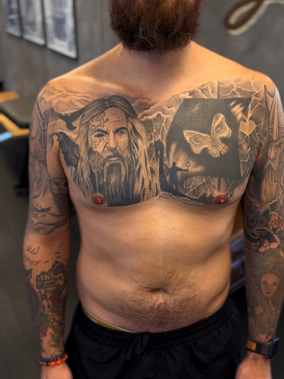 bearded mountain-man portrait alongside dark square panel with butterfly across upper chest