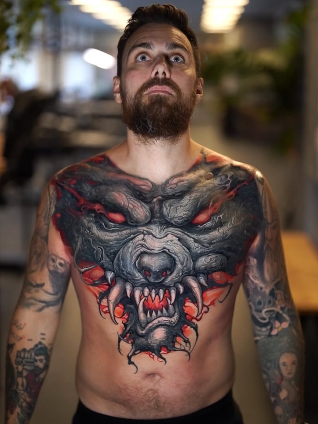 snarling demon-wolf head with red eyes, fangs, red maw, claws and smoke wrapping the chest