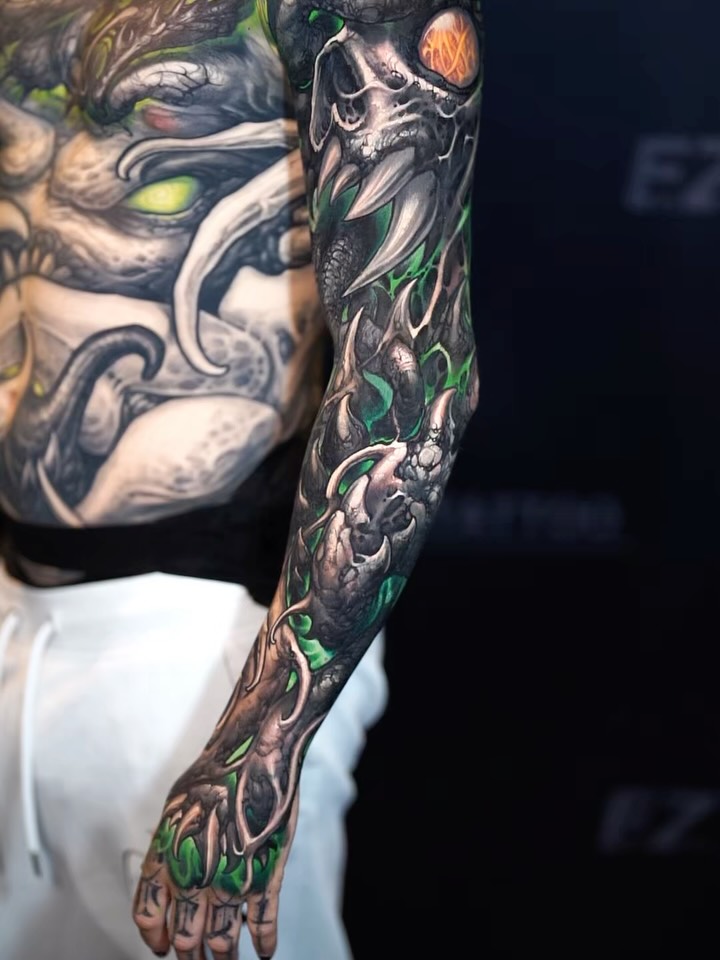 bio-mech skull sleeve with green flame negative space, claws, hand piece, blending into chest demon
